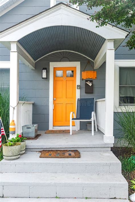 Yellow Front Door of the House, Facade of the House with a Stone Porch ...