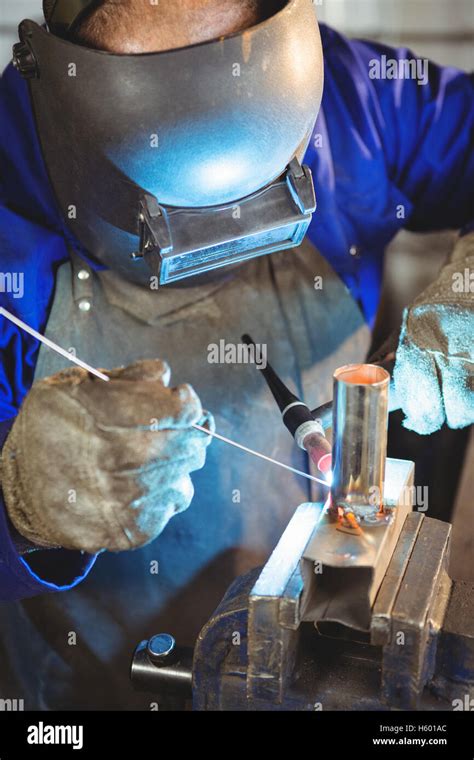 Welder welding a metal Stock Photo - Alamy