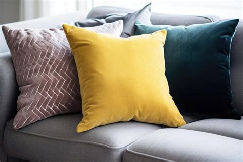 Premium AI Image | A trio of pillows in different colors on a sofa