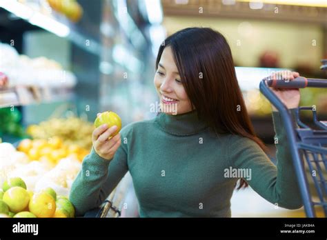 One Young Chinese Woman Shopping In The Supermarket Stock Photo Alamy