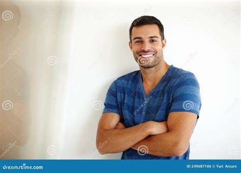 Filled With Positivity A Handsome Young Man Smiling While Standing