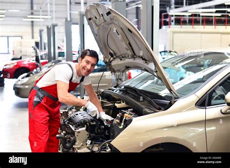 Car Mechanic In A Workshop Working At Car Stock Photo Alamy