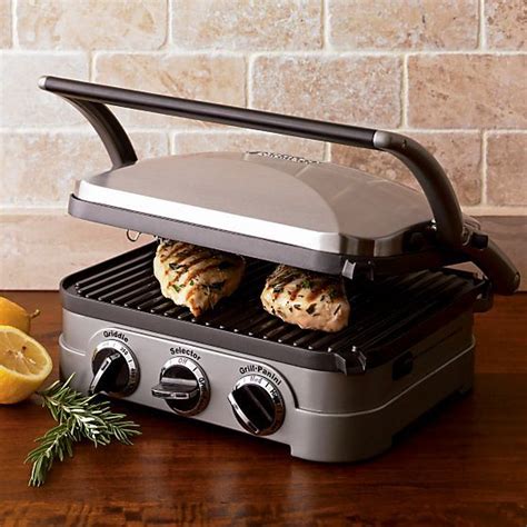 an electric grill with cookies and lemons on it