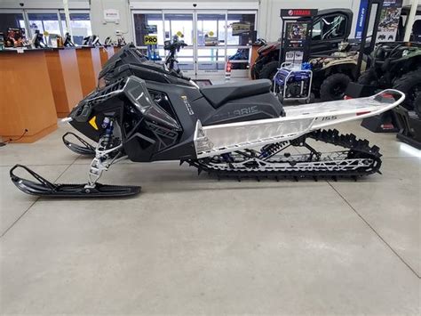 2024 Polaris® 850 Rmk Khaos 155 Gloss Blackmilitary Tanorange Burst