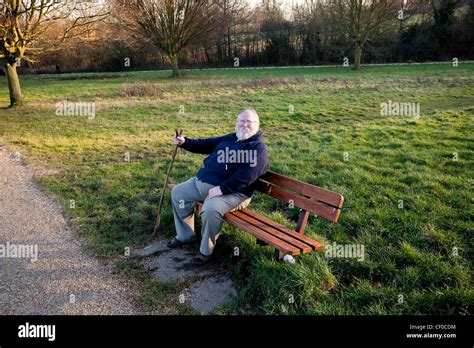 An Old Man Sitting On A Bench At A Park Stock Photo 43650368 Alamy