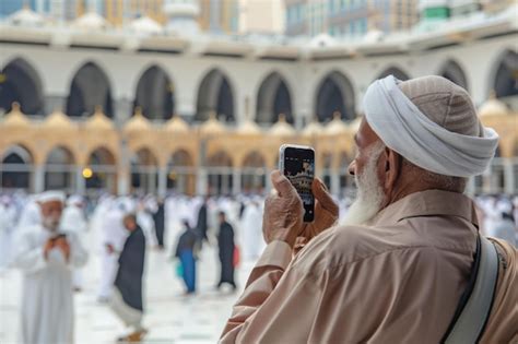 Premium Photo | Pilgrim Takes Photos of Kaaba in Mecca During Daytime ...