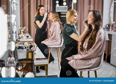 Makeup Artists Doing Makeup On Female Clients In Beauty Salon Stock