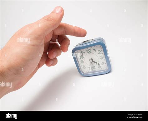 Hand Turning Off Alarm Clock Stock Photo Alamy