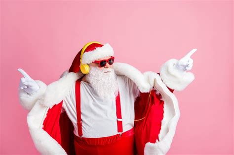 Photo Of Confident Modern Funky Santa Claus Listen Headphones X Mas