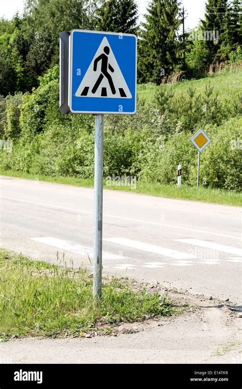 Road sign with zebra pattern pedestrian crossing Stock Photo - Alamy