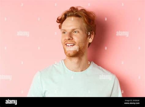 Portrait Of Attractive Caucasian Guy With Red Messy Hair And Beard