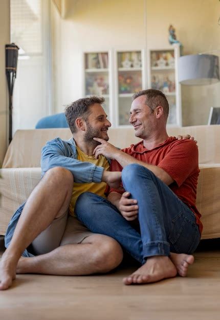 Premium Photo Gay Men Couple At Home Sofa Sitting Showing Affection