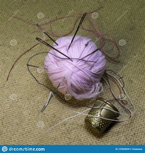 Ball Of Yarn Needles And Thimble Are On The Table Stock Image Image