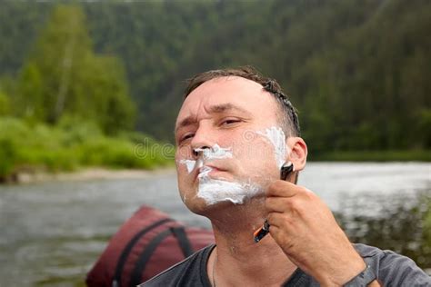 Mature Man Is Shaving In Nature Stock Photo Image Of Public Care