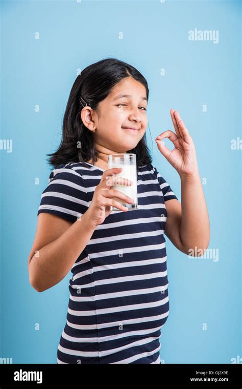 Indian Girl With A Glass Of Milk Asian Girl Drinking Milk In A Glass