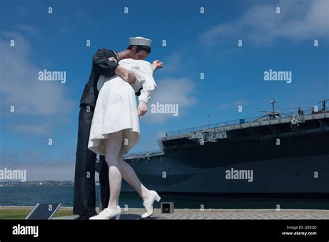 Unconditional Surrender Sculpture By Seward Johnson And Uss Midway Aircraft Carrier San