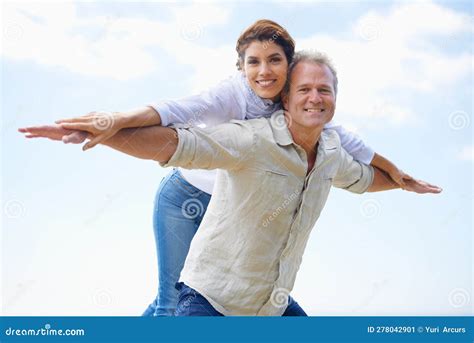 Appreciating One Another A Happy Mature Couple With Their Heads