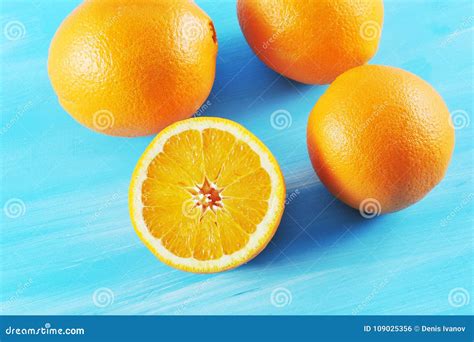 Fresh Juicy Orange Cut In Half Stock Photo Image Of Oranges Studio