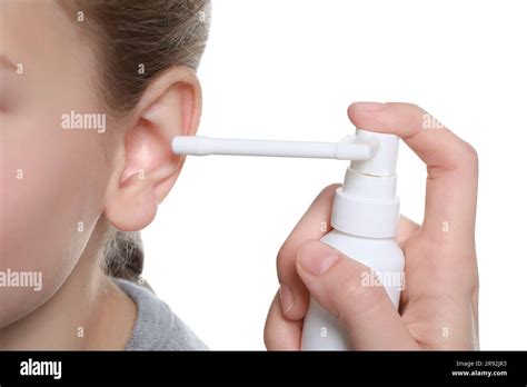 Mother Spraying Medication Into Daughters Ear On White Background