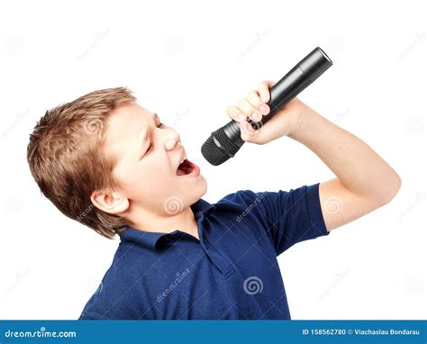 Teenage Boy Singing Into A Microphone Very Emotional Stock Photo