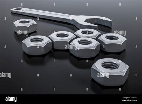 3d illustration of a hexagon nut with a wrench Stock Photo - Alamy