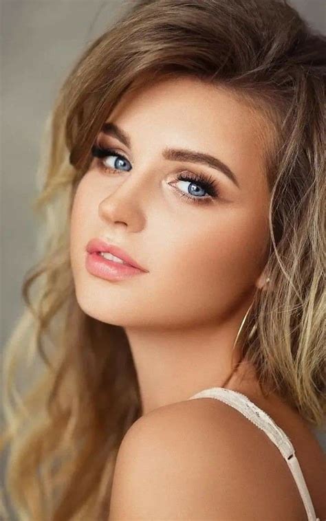 A Woman With Blue Eyes And Blonde Hair
