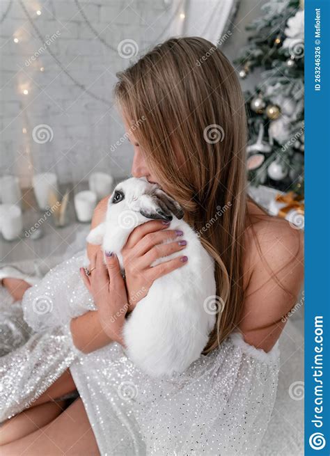 Woman Holding A White Rabbit Symbol Of The Year 2023 Close Up Of A