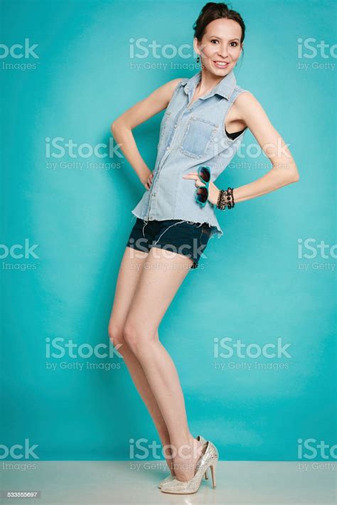 Summer Fashion Girl In Jeans Shirt Shorts And High Heels Stock Photo