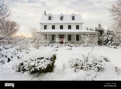 White Farmhouse With Red Door After Snowstorm Fallston Maryland