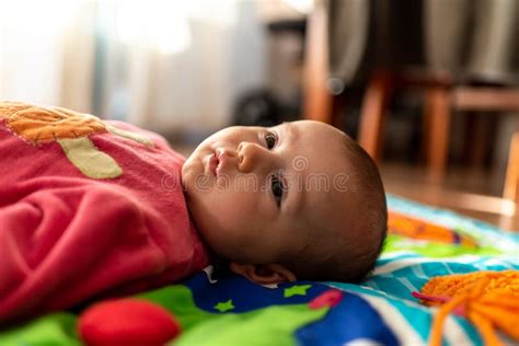 Newborn Baby Resting Relaxed Face Up On A Carpet Stock Image Image Of