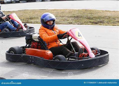 Girl is Driving Go-kart Car with Speed in a Playground Racing Track Stock Image - Image of ...