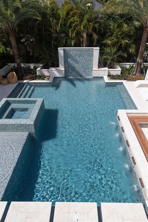 Elegant Geometric Pool With StoneScapes French Gray Mini Pebble Finish