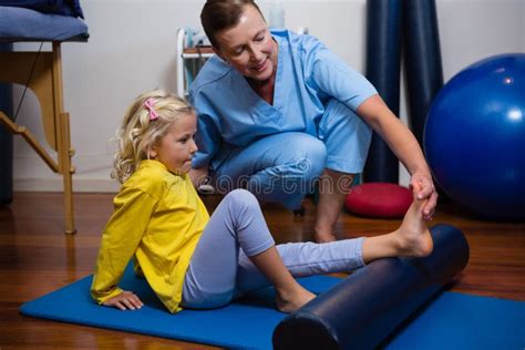 Physiotherapist Giving Physical Therapy To The Girl Stock Image Image