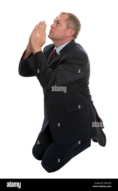 Businessman On His Knees Praying Stock Photo Alamy