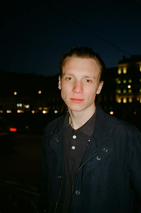 man standing  red wall  stock photo
