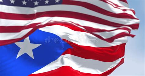 Seamless Loop In Slow Motion Of Puerto Rico And Us Flags Waving On A