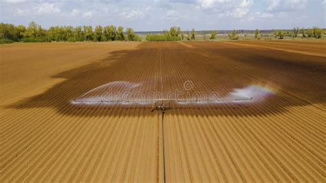 Irrigation System on Agricultural Land. Stock Image - Image of spray ...