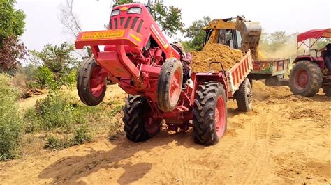 Jcb 3dx Machine Loading Red Mud In New Mahindra 265 Di Tractor Jcb