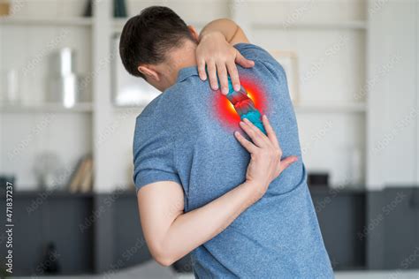 Intervertebral Spine Hernia Pain Between The Shoulder Blades Man