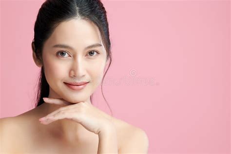 Beautiful Young Asian Woman With Clean Fresh Skin On White Background