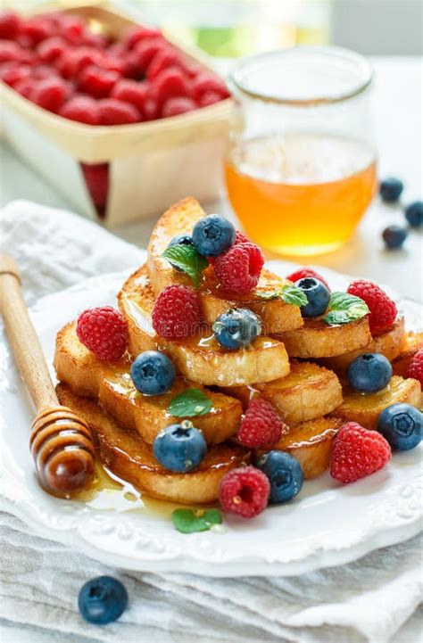 Traditional Breakfast French Toast With Honey And Fresh Berries