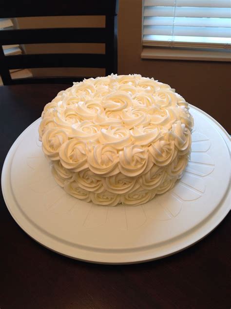 Buttercream Rosettes On A Raspberry Cake With Vanilla Mousse Filling