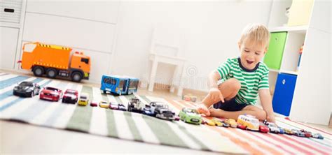 Little Child Playing with Toy Cars Stock Image - Image of lifestyle ...