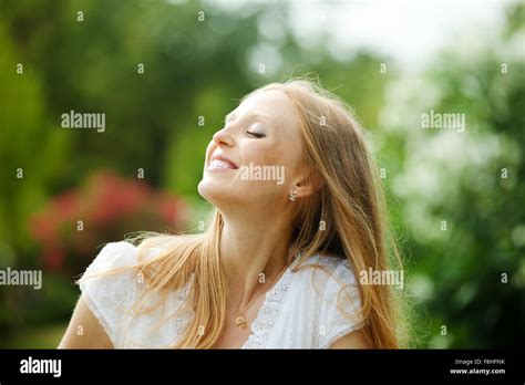 Enjoying Blonde Long Haired Woman At Nature Stock Photo Alamy