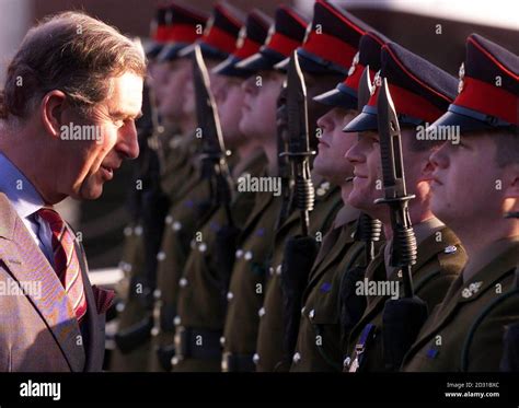 Hrh Prince Charles The Prince Of Wales Inspects A Guard Of Honour