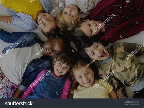 Group Kids Laying On Floor Smiling Stock Photo 582992581 Shutterstock