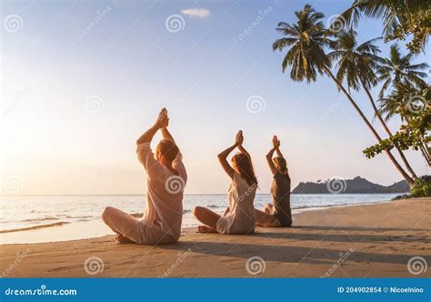 People Practicing Yoga On The Beach Wellbeing Warm Tropical Landscape