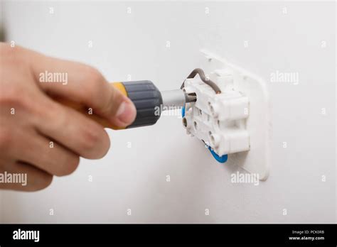 Electrician Installing Electrical Socket Stock Photo Alamy