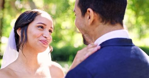 Wedding Bride And Groom Kissing In Garden For Celebration Of Love