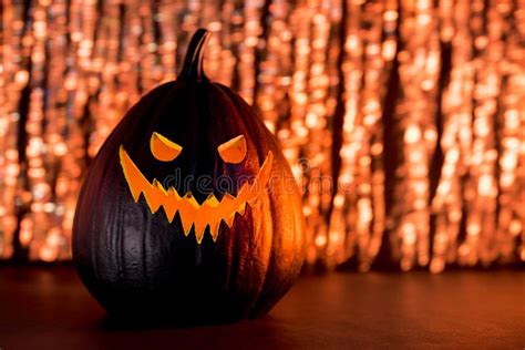 Spooky Halloween Black Pumpkin Jack O Lantern With Orange Illuminated